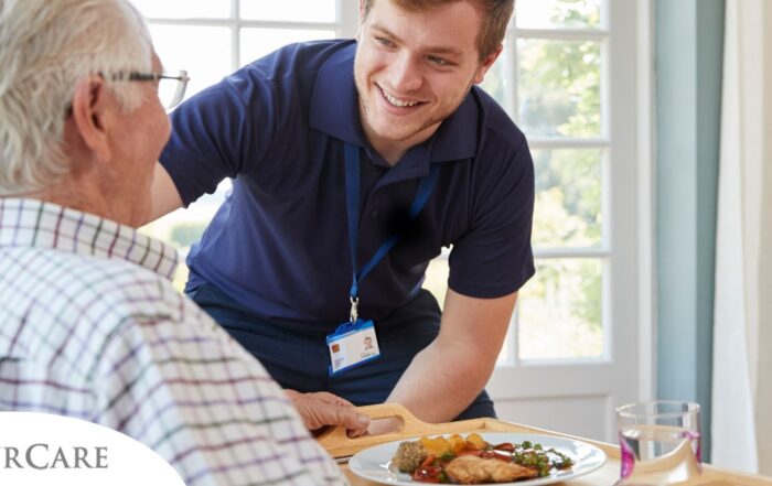 Professional caregiving involves helping clients with iADLs and ADLs as demonstrated by this caregiver helping a client by bringing a meal.