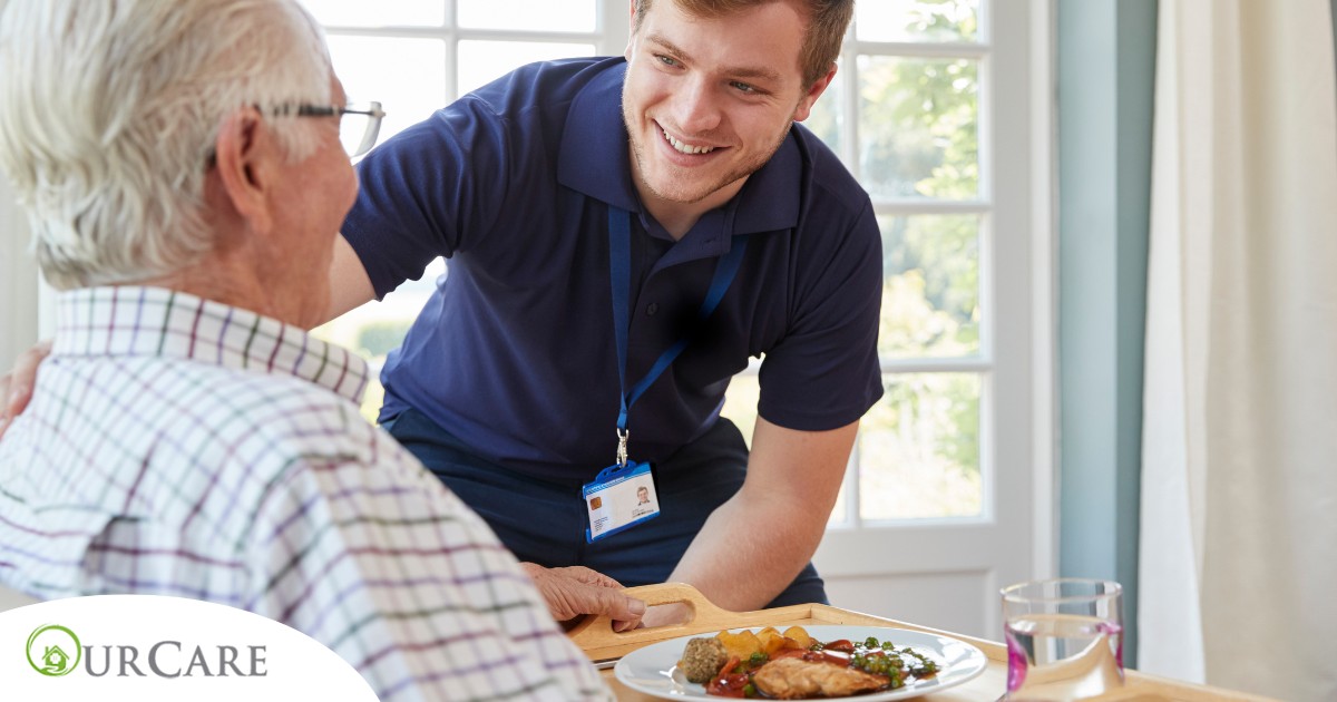 Professional caregiving involves helping clients with iADLs and ADLs as demonstrated by this caregiver helping a client by bringing a meal.