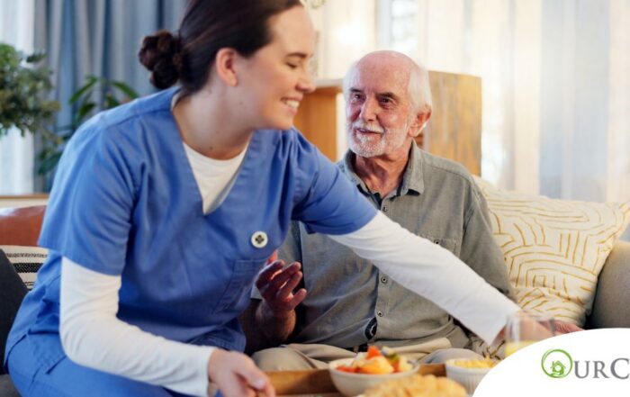 Caregiver providing senior care at home to manage parkinson’s and related symptoms.