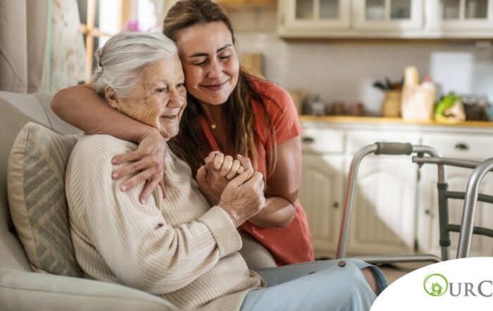 Caregiver supporting an elderly woman in the transition to senior home care