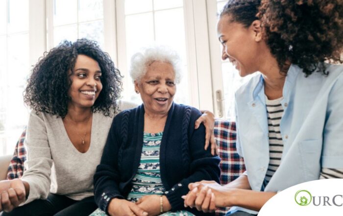 Caregiver talking to a family about Elderly Care