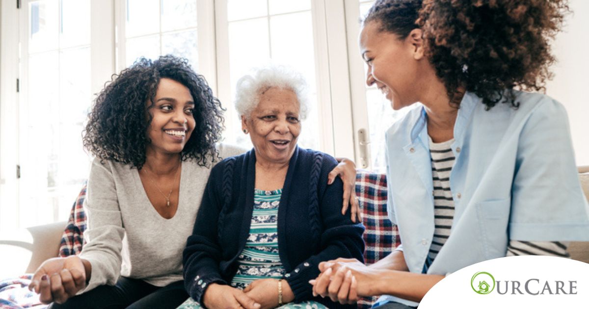 Caregiver talking to a family about Elderly Care