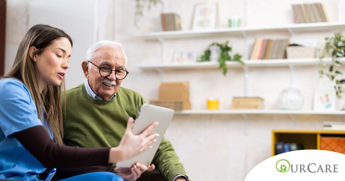 Home caregiver assisting senior man to use telehealth and senior care